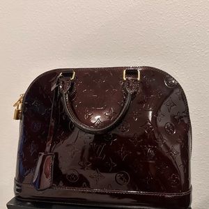 LOUIS VUITTON
Wine Monogram Vernis Alma PM Top Handle Bag
